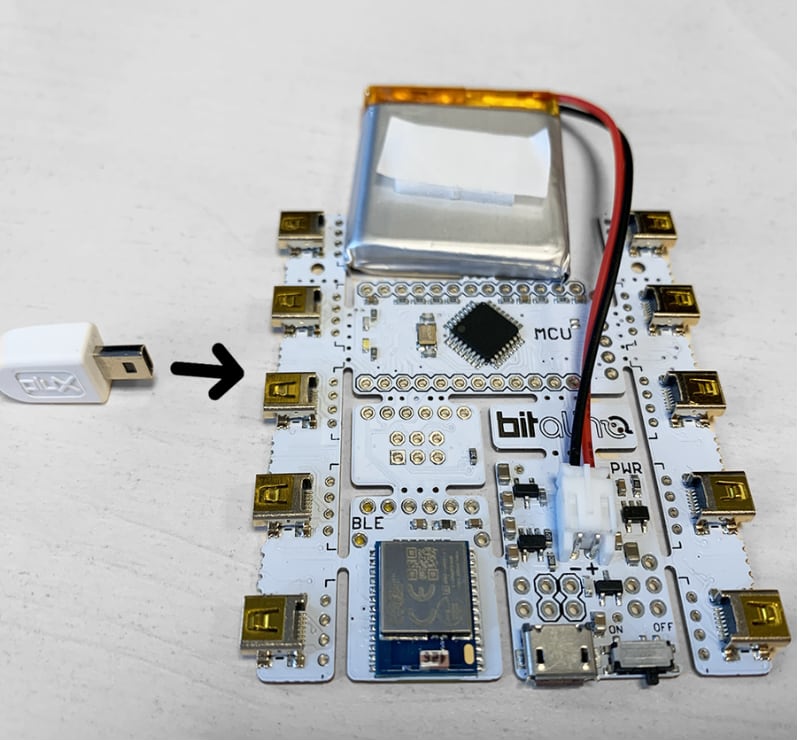 Plugging a PLUX cable into one of the board's analog channel ports