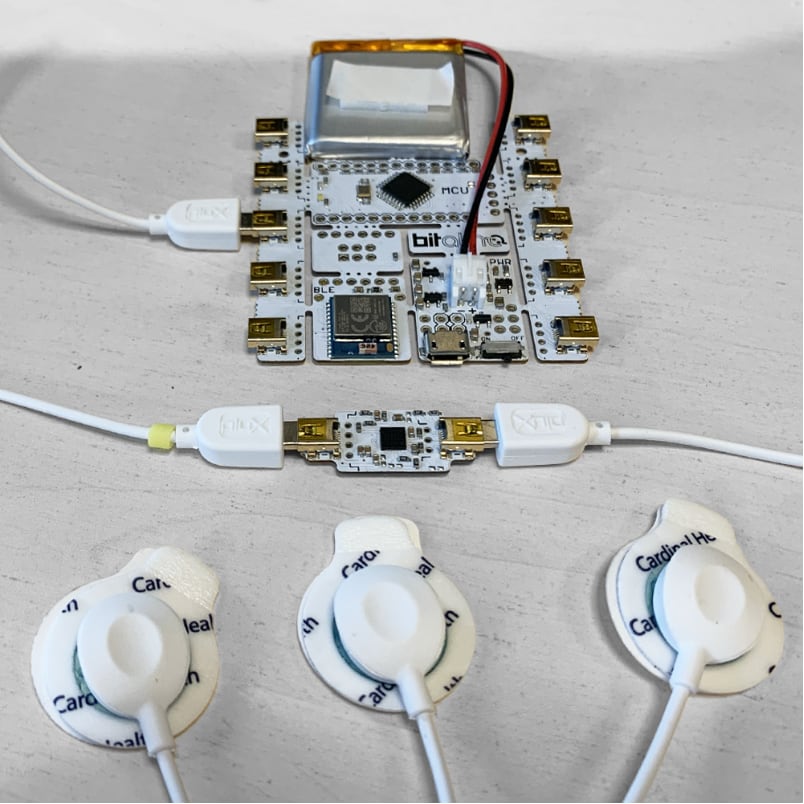 The three electrode leads plugged into the EMG module's inputs